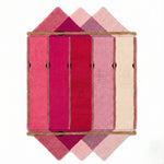 The Pink Prism Geometric Hand-Tufted Wool Rug features a vibrant array of pink hues arranged in a stunning geometric pattern, perfect for adding a contemporary flair to your living room. This wool rug combines the charm of vintage design with modern aesthetics, making it an ideal choice for area rugs for the living room.