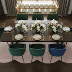 Dining table set with plates, silverware, and floral centerpieces in a stylish room.