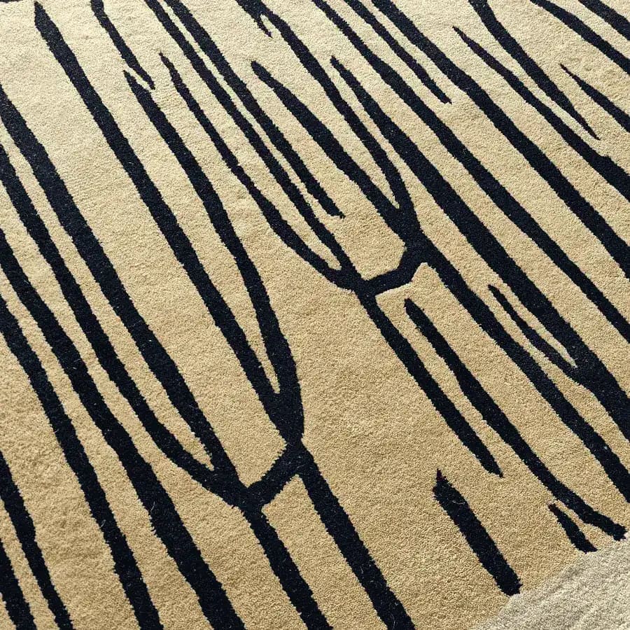 Close-up view of a Pink Scalloped Contemporary Art Hand Tufted Area Rug, featuring a striking abstract pattern with deep black lines against a beige backdrop. This wool rug is perfectly designed for living room spaces, especially as an area rug in an 8x10 size.