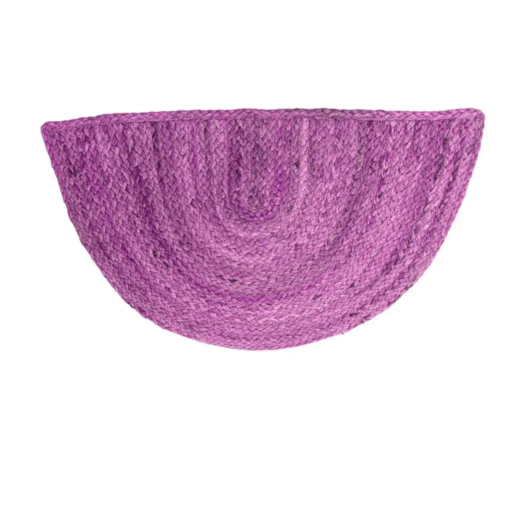 Vibrant pink semi-circle area rug made from durable jute, perfect for adding a pop of color to your dining room or large living room. This round rug design is ideal for those looking to enhance their living space with stylish dining room carpets and living room accents.