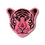 A vibrant Pink Tiger Face Hand-Tufted Wool Accent Rug, perfect for a contemporary living room. This striking area rug, shaped like a tiger's face, adds a bold statement to large living room spaces. Ideal for those looking for unique living room rugs in 8x10 dimensions, this wool rug combines artistry with comfort.