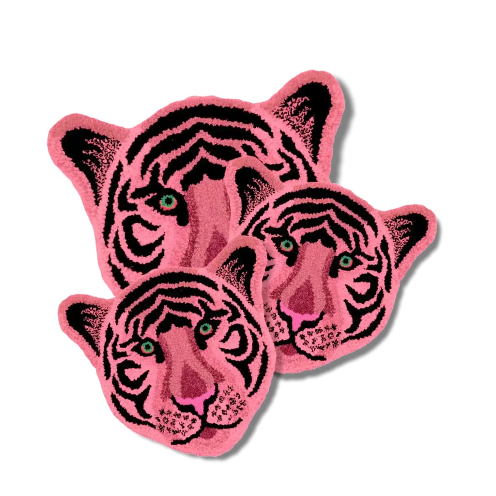 A vibrant and contemporary hand-tufted wool area rug showcasing an abstract pink tiger face design. This unique rug is perfect for adding a bold statement to large living rooms. Ideal as a living room rug 8x10, it blends artistic flair with the warmth and comfort of a wool rug.