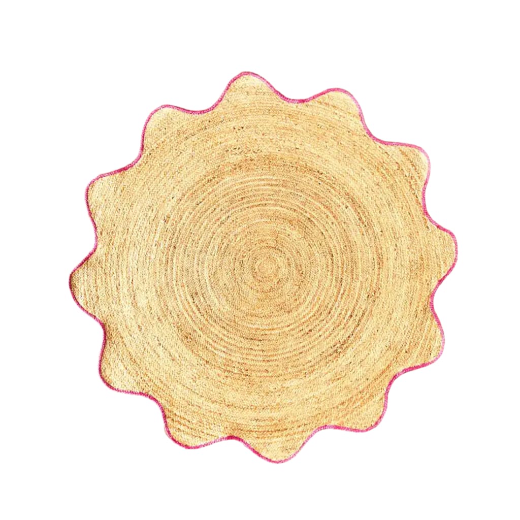 This image features a round area rug made from natural jute, highlighted with a pink trim. Perfect for adding a touch of elegance to dining rooms and living rooms, this jute rug serves as a stylish centerpiece in any living room area. Its unique round shape and natural texture make it an ideal choice for those seeking rugs for living room spaces.