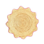 This image features a round area rug made from natural jute, highlighted with a pink trim. Perfect for adding a touch of elegance to dining rooms and living rooms, this jute rug serves as a stylish centerpiece in any living room area. Its unique round shape and natural texture make it an ideal choice for those seeking rugs for living room spaces.