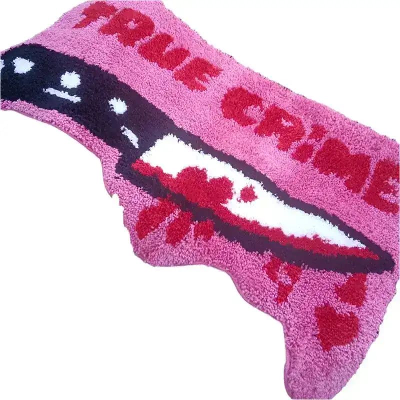 Vibrant pink area rug with a bold 'True Crime' design, featuring a graphic of a knife, perfect for adding a unique touch to living room area rugs. Ideal for those seeking distinctive rugs for living room decor.