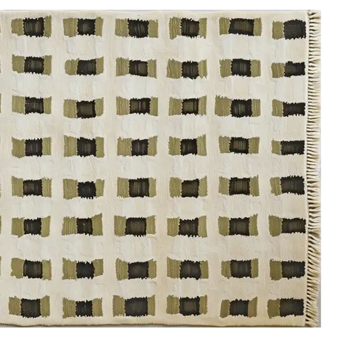 Top view of a contemporary wool area rug featuring a geometric pattern in earthy tones. This large living room rug showcases a unique design with rectangular motifs, perfect for adding a modern touch to any space.