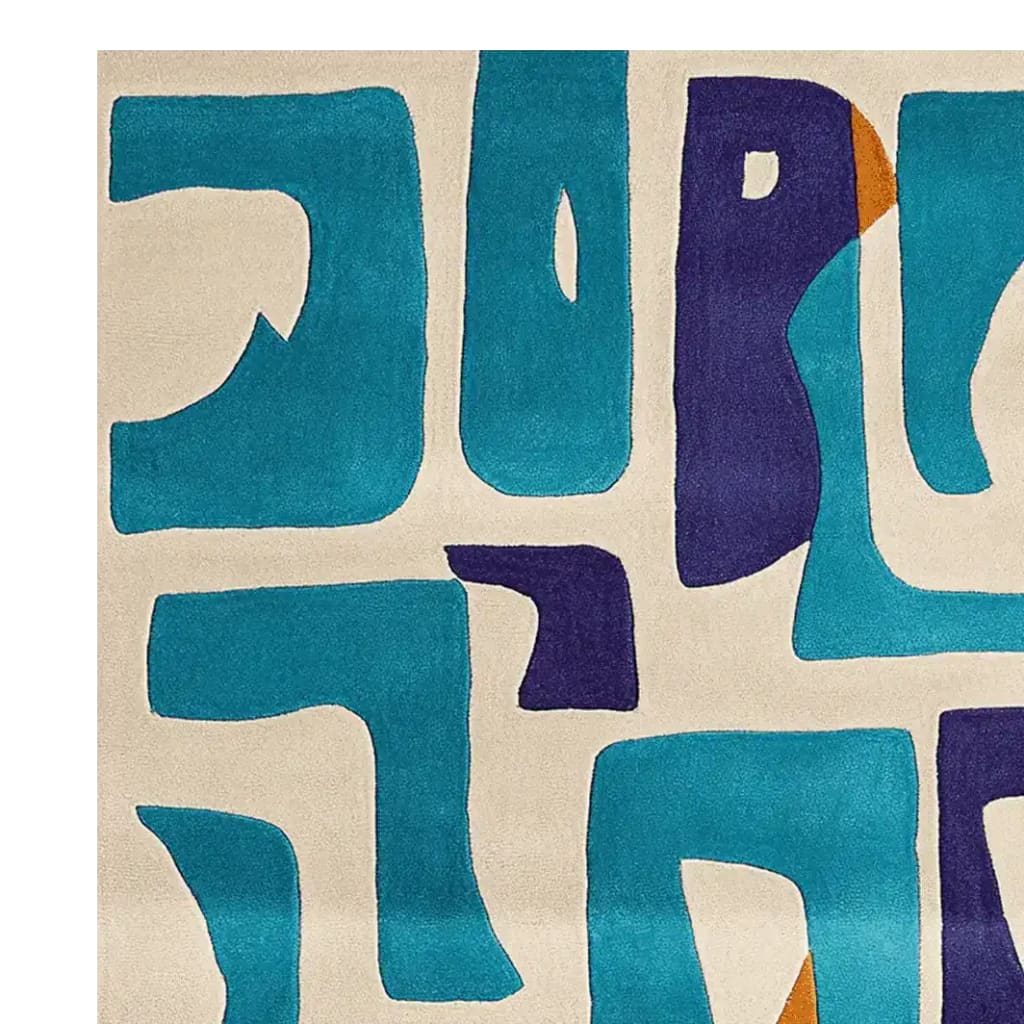 Close-up view of the Playful Form Lane Hand Tufted Area Rug featuring an abstract design in vibrant blue and purple shapes on a neutral background. This contemporary wool rug adds a modern touch to living room area rugs, available in an 8x10 size.