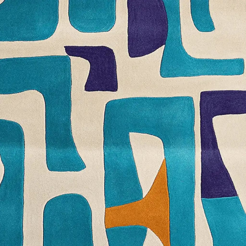 A vibrant, contemporary area rug featuring an abstract design with bold patches of teal, blue, and orange on a beige background. Perfect for adding a playful touch to your living room area. This wool rug is ideal for those seeking unique living room rugs in an 8x10 size.