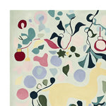 A vibrant, hand-tufted area rug featuring an abstract design with various colorful shapes and patterns. The wool rug showcases a lively mix of greens, reds, and blues, making it a perfect accent for large living room rugs.