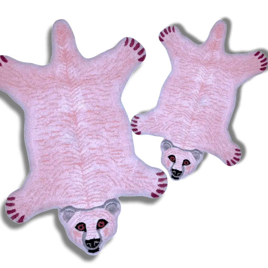 Charming polar bear shaped tufted wool rugs in pink, ideal as area rugs for a cozy living room or under a dining table. These playful wool rugs add a touch of whimsy to any dining room or living room space.