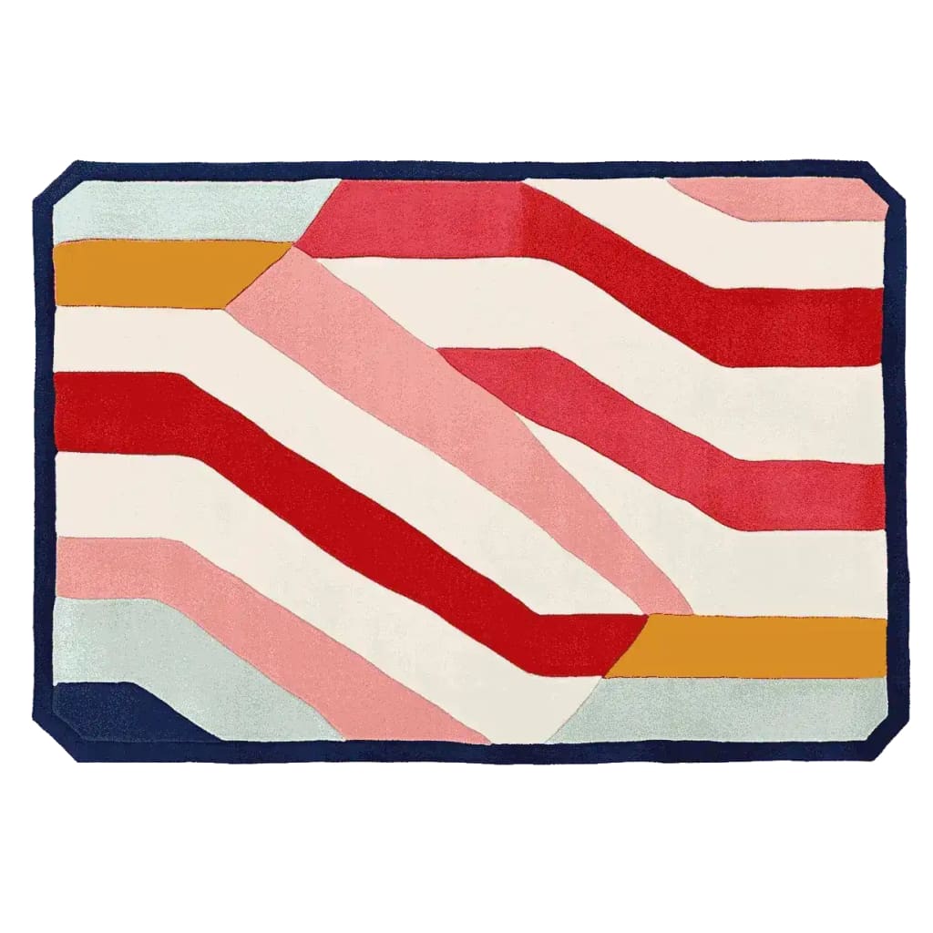 Vibrant area rug with bold stripes in red, pink, and mustard yellow on a hand-tufted wool surface. This contemporary rug is perfect for adding a pop of color to living room area rugs.