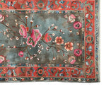 A beautifully detailed area rug featuring vibrant floral designs in pink and red on a soft blue background. This wool rug is perfect for adding a touch of elegance to large living room spaces, making it an ideal choice for those seeking high-quality area rugs for living rooms.