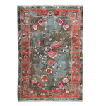 The Poppy Sonata Knotted Wool Rug is an exquisite area rug featuring a vibrant floral design with rich colors of red, pink, and green on a contrasting background. Perfect for adding elegance to large living room spaces, this wool rug combines artistry and function, making it an ideal choice for area rugs for living rooms.