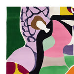 A vibrant and contemporary hand-tufted area rug featuring a modern abstract design with bold colors like pink, green, and purple. This wool rug is perfect for adding a splash of color to your living room. Ideal as a living room rug in an 8x10 size.