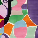 Vibrant and colorful contemporary area rug featuring abstract geometric patterns in shades of pink, green, orange, and purple. This wool rug is perfect for adding a pop of color to your living room, available in an 8x10 size.