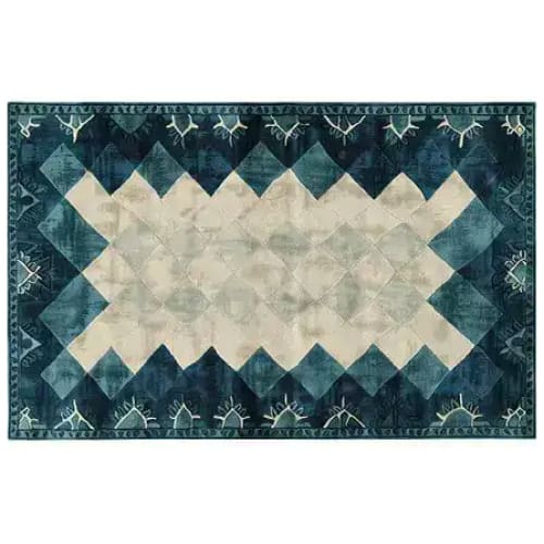 Top view of the Prism Tides Hand Tufted Wool Rug, showcasing its contemporary design with a striking geometric pattern in shades of blue and cream. Perfect for adding a modern touch to your living room or office, this area rug combines style with the comfort of wool.