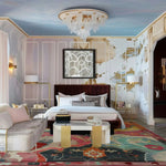 This elegant area rug adds a vintage charm to a luxurious living room setting. The Prismatic Core Hand Tufted Rug, measuring 8 x 10 ft, showcases an intricate abstract design with vibrant colors, making it an ideal centerpiece for large living room spaces. The wool rug complements the sophisticated decor, featuring plush furniture and stylish lighting, enhancing the cozy atmosphere of this living room area.