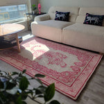 Bright living room featuring the Prowess in Pink Garden Hand-Tufted Area Rug with a bold pink tiger design. This wool rug provides a cozy and stylish touch to the large living room, complementing the modern sofa and chic decor.