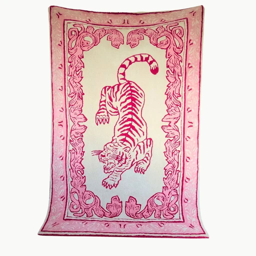 A vibrant area rug featuring a hand-tufted design with a striking pink tiger in the center, surrounded by intricate floral patterns. This wool rug is perfect for adding a bold statement to a living room, especially suited for large living room spaces.