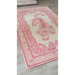 A stylish area rug featuring an abstract pink tiger design against a soft beige background, perfect for a large living room. This hand-tufted wool rug adds a touch of elegance and artistic flair to any living space.