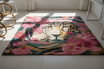 Decorative rug with a leopard and floral design on a white floor.