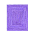 Top view of a vibrant Purple Hand Braided Jute Rug, perfect for adding a pop of color to living room area rugs. This large living room rug showcases intricate hand-braided patterns, ideal for enhancing the aesthetic of any living space.