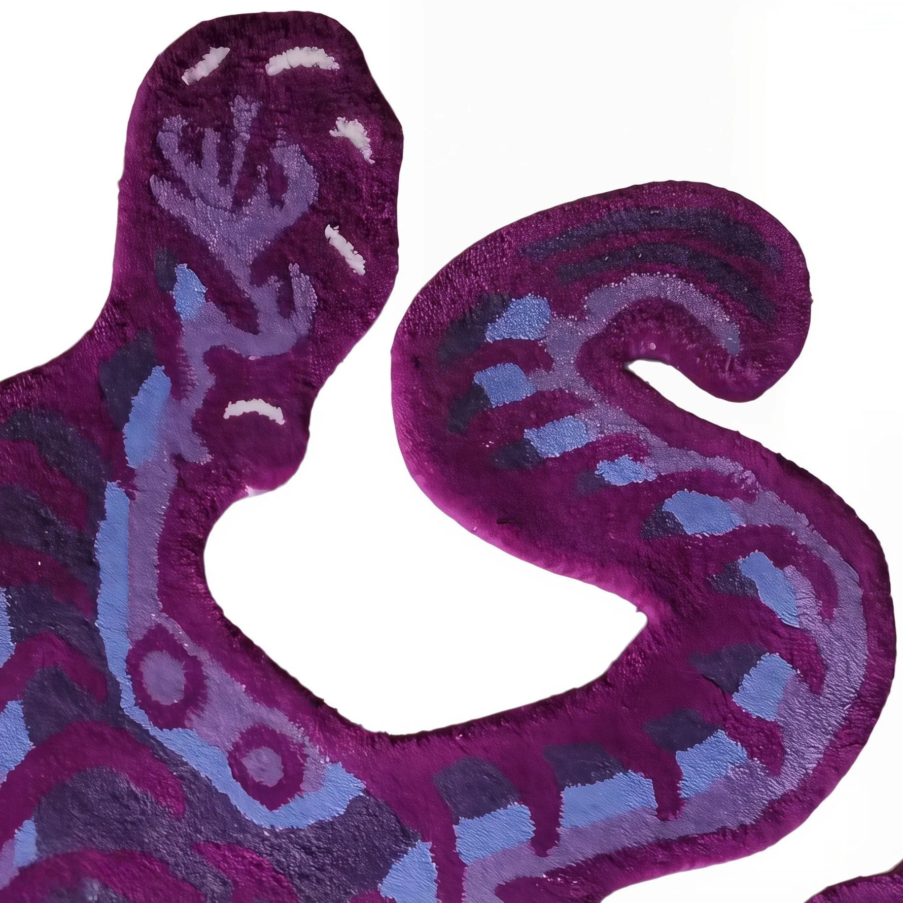Close-up of a purple Tibetan tiger wool rug showing the detailed abstract tiger pattern.