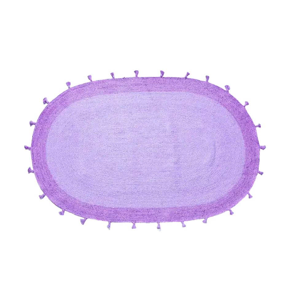 A stylish purple two-toned oval jute area rug with tassels, perfect for adding a boho touch to a living room. Ideal as an 8x10 rug for cozy spaces, this rug showcases a unique design that enhances any living room decor.