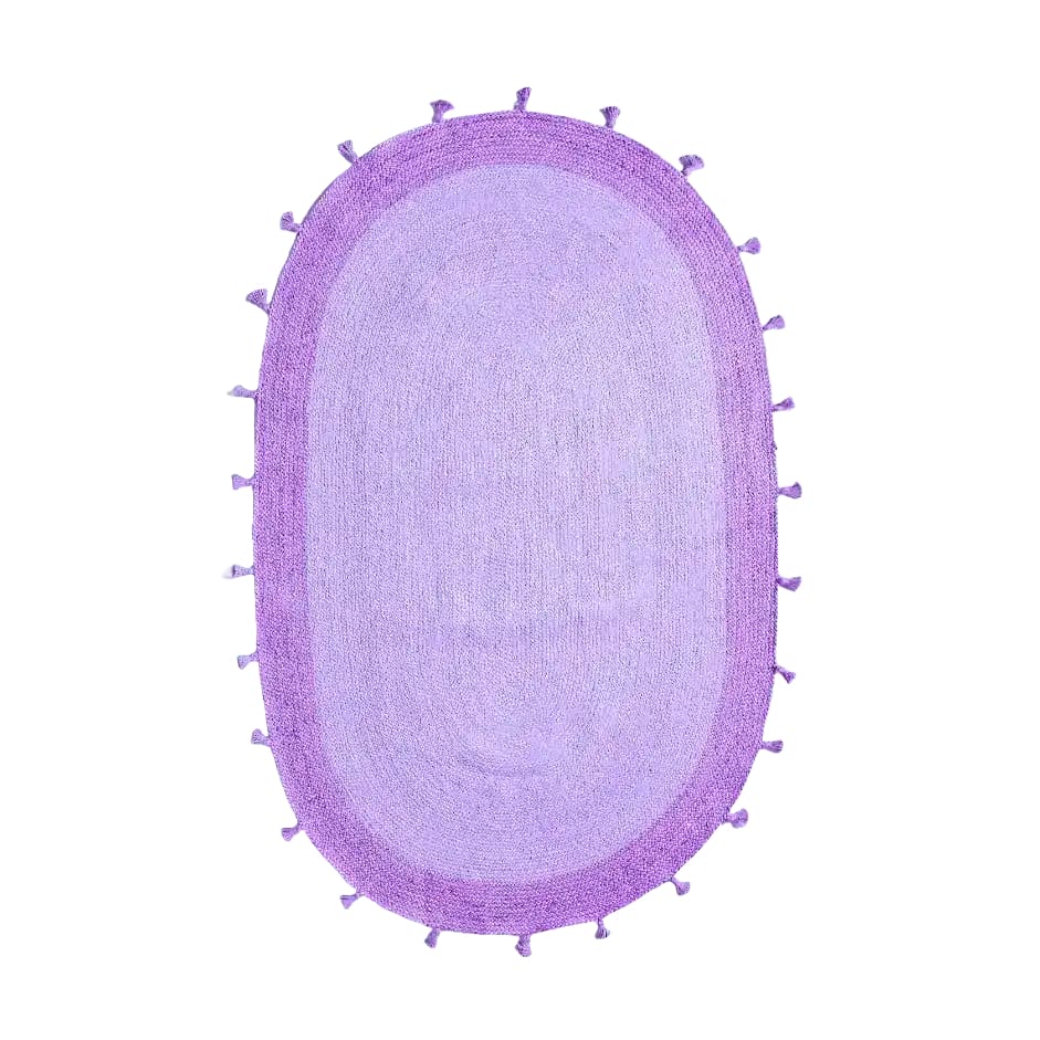 A beautiful purple two-toned oval jute rug with tassels, perfect for adding a boho touch to your living room. This area rug is ideal for spaces looking for an 8x10 living room rug to enhance the decor with its natural texture and vibrant color.