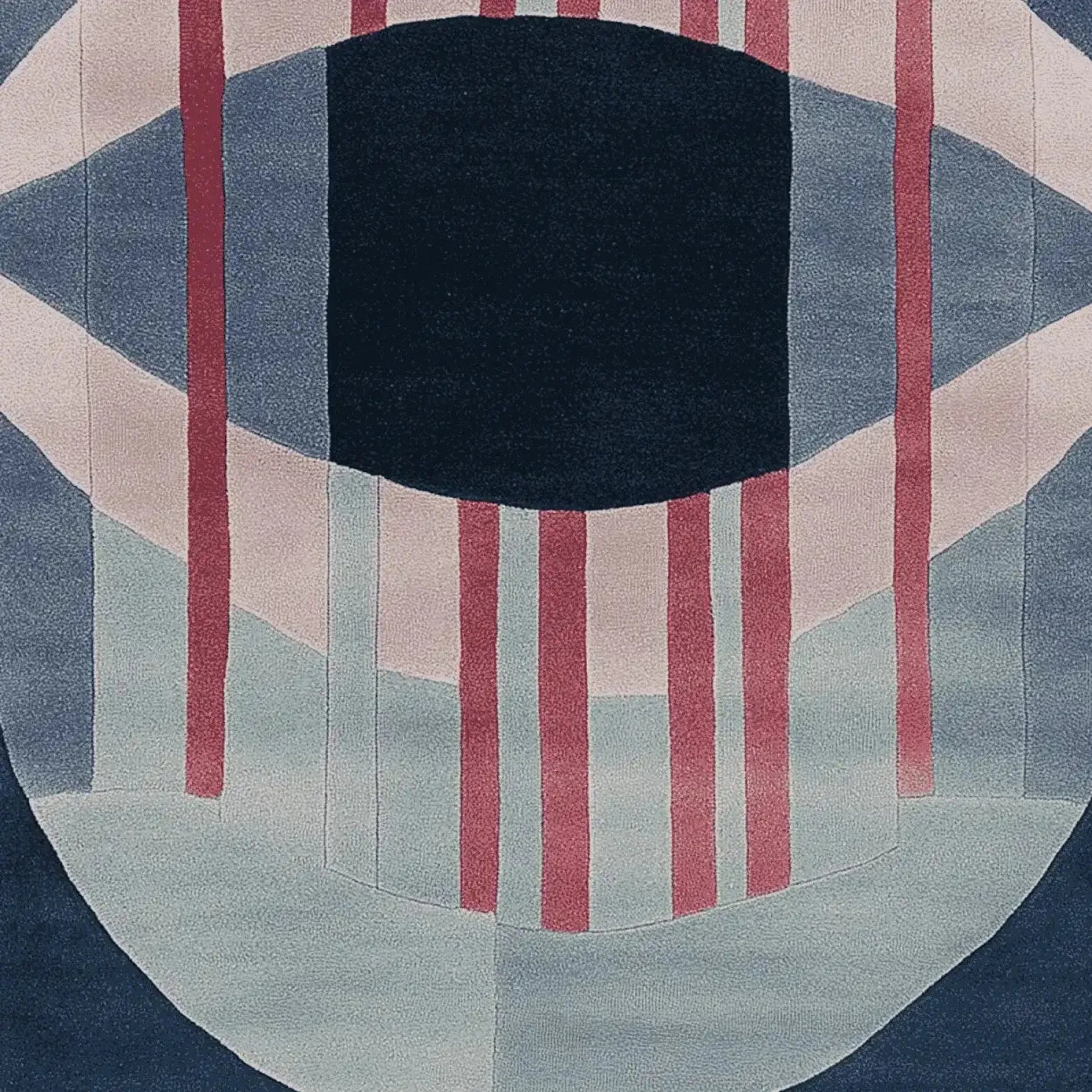 This contemporary wool area rug features an abstract design with bold geometric patterns in shades of blue, pink, and red. Perfect for adding a modern touch to large living room spaces, this hand-tufted rug combines style and comfort, making it an ideal choice for area rugs in living rooms.
