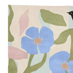 A beautiful hand-tufted area rug featuring an abstract design with vibrant blue flowers and green leaves on a neutral background. This contemporary wool rug adds a touch of elegance to any living room space, perfect as an 8x10 area rug.