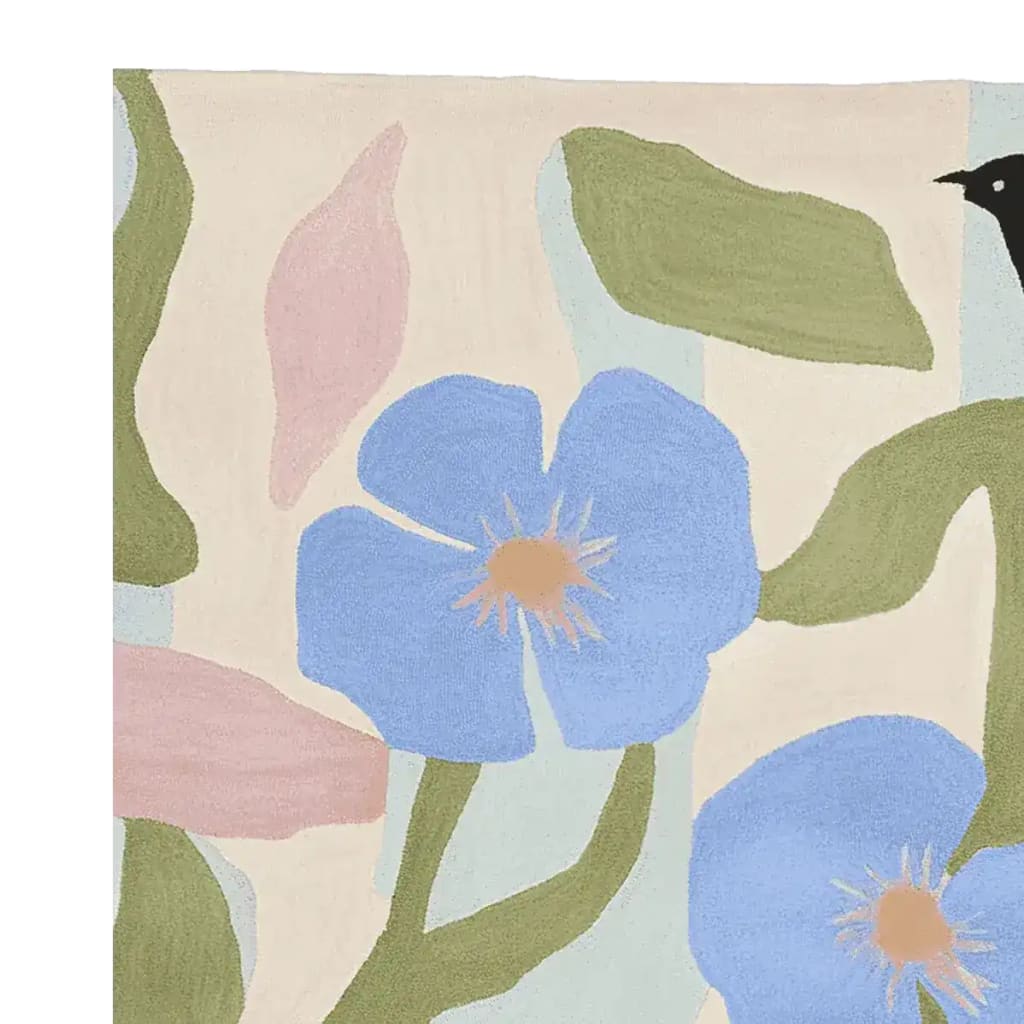 A beautiful hand-tufted area rug featuring an abstract design with vibrant blue flowers and green leaves on a neutral background. This contemporary wool rug adds a touch of elegance to any living room space, perfect as an 8x10 area rug.