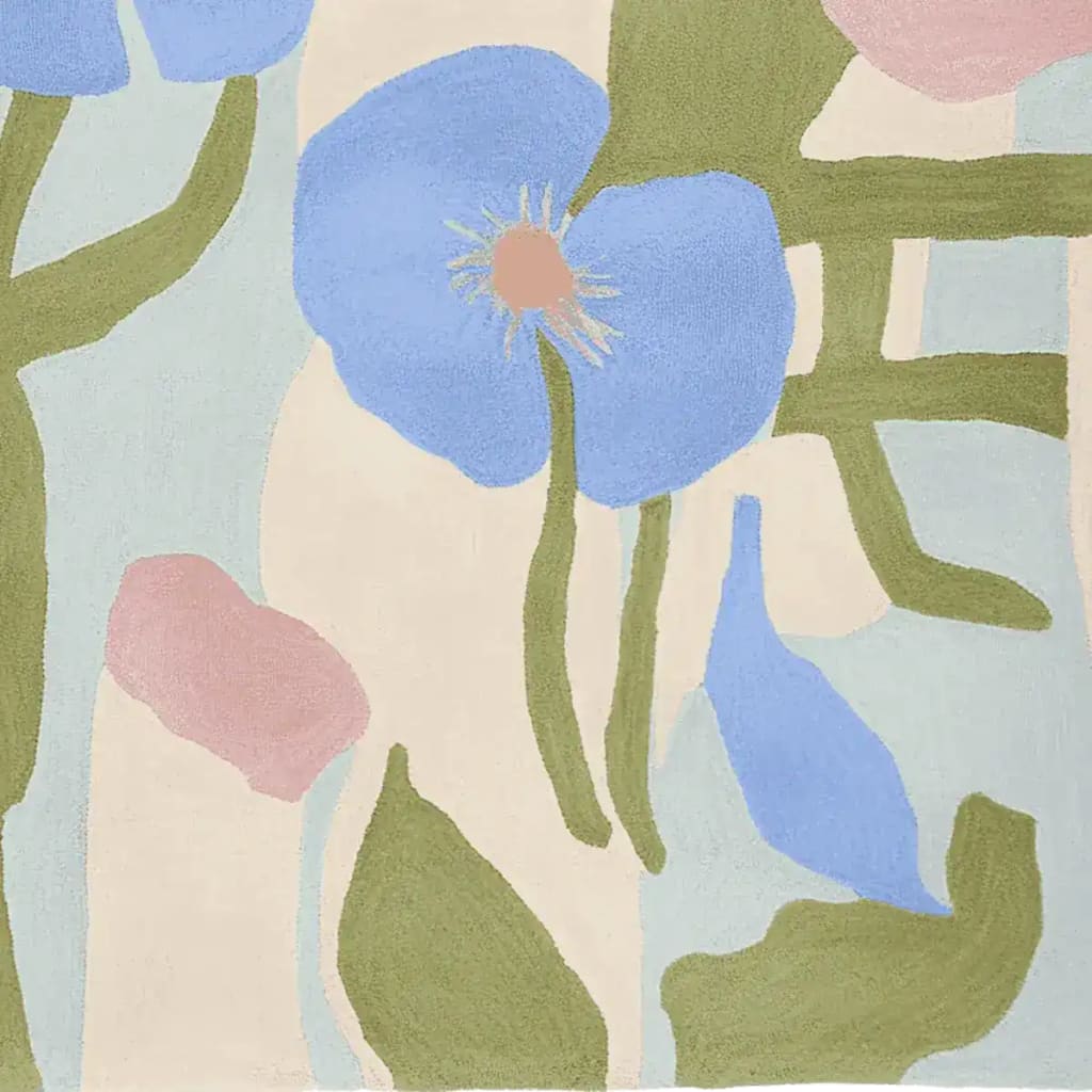 A vibrant and contemporary hand-tufted area rug in an abstract floral design featuring soft blue and green hues. This wool rug is perfect for adding a touch of elegance to living room spaces, especially in an 8x10 size. Ideal for those looking for stylish area rugs for living rooms.