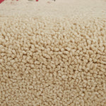 Close-up of beige carpet texture