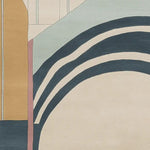 Close-up view of a contemporary wool rug featuring a geometric design with bold colors and curved patterns. Perfect for adding a modern touch to your living space, this 8x10 area rug is ideal for living rooms, combining style and comfort.