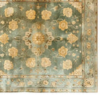 Top view of the Radiant Blooms Knotted Wool Rug, showcasing intricate floral patterns in soft hues, perfect for adding elegance to any living room. This area rug is crafted from high-quality wool, ideal for those seeking luxurious rugs for living room spaces.