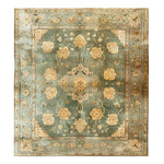 Elegant Radiant Blooms Knotted Wool Rug with intricate floral patterns in soft beige and blue tones, perfect as an area rug for adding warmth and style to your living room.