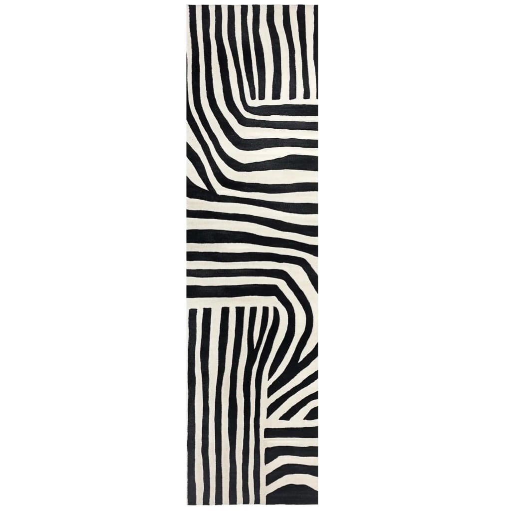 Top view of a contemporary runner rug showcasing a bold, black and white abstract pattern. Perfect for kitchens, hallways, and bathrooms, this hand-tufted wool rug adds a stylish touch to any space.