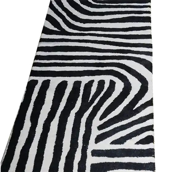 Top view of a Radiant Burst Hand Tufted Wool Rug featuring an abstract black and white pattern, ideal as a runner rug for kitchens, hallways, or bathrooms. This contemporary wool rug adds a modern touch to any space.