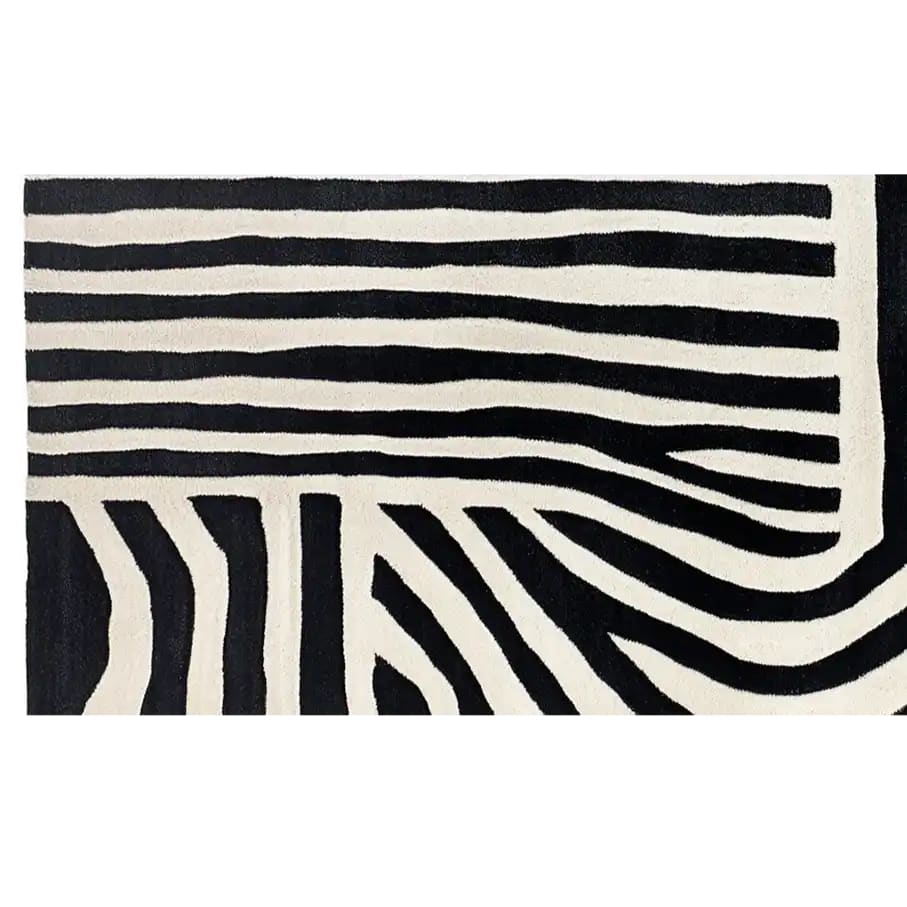 A striking black and white striped wool rug with a zebra pattern, perfect for adding a contemporary touch to any space. This runner rug is ideal for kitchens, hallways, or bathrooms, offering a stylish and durable option for high-traffic areas.