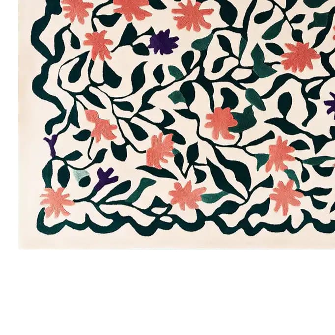 A vibrant area rug featuring a contemporary design with dark green vines and leaves intertwined with pink and purple flowers. This hand-tufted wool rug adds a lively touch to any living room, making it a perfect choice for those seeking stylish and cozy area rugs for living room decor.