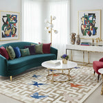 Modern living room with teal sofa, colorful artwork, and decorative rug.