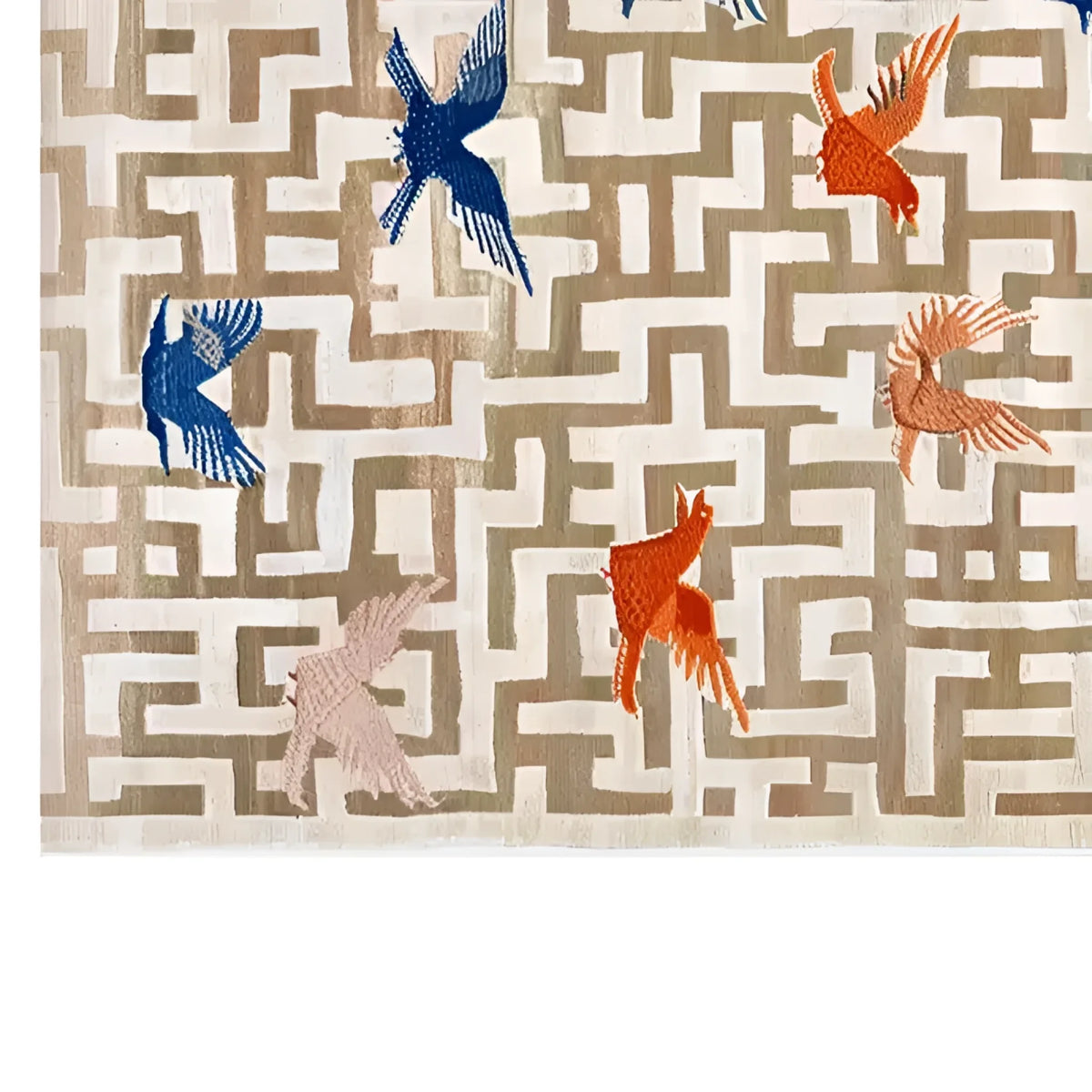 A beautifully designed area rug featuring a contemporary pattern with vibrant birds in blue, red, and orange, set against a neutral geometric background. This hand tufted wool rug is perfect for adding a touch of elegance and warmth to your living room, making it an ideal choice for those seeking large living room rugs.