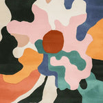 Top view of the Radiant Petal Chaos Hand Tufted Area Rug featuring a bold, abstract floral pattern with vibrant colors like pink, orange, green, and blue. This contemporary wool rug is perfect as a large living room rug, adding a touch of artistic flair to any space. Ideal for those seeking striking area rugs for living rooms.
