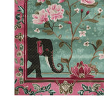 Close-up view of the Radiant Petals Hand Tufted Wool Rug, showcasing a vibrant design featuring a majestic elephant and pink floral patterns, perfect for large living room spaces. This wool rug combines elements of Persian rugs with a modern twist, making it an ideal choice for rugs for living room areas.
