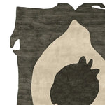 Image of a Raw Edge Totem Hand Tufted Rug, showcasing an abstract design with a mix of dark and light tones. This contemporary wool rug is perfect for adding a modern touch to living room area rugs.