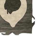 A contemporary wool rug with an abstract design, featuring raw edges and a totem-like pattern. This area rug, perfect for modern living rooms, showcases a blend of dark and light shades, creating a striking visual contrast.