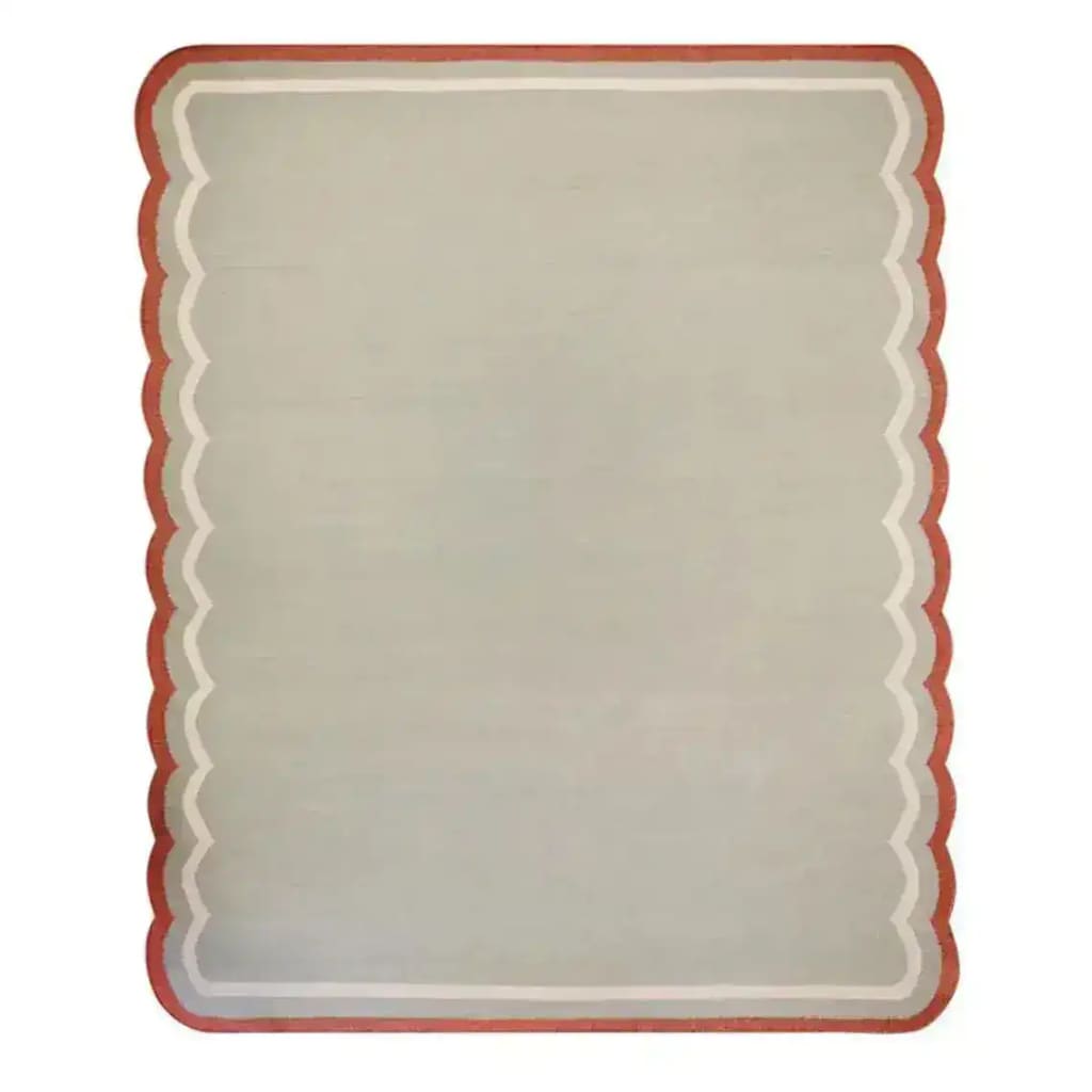 Top view of a Red and Gray Scallop Cotton Area Rug, ideal for living rooms and offices, featuring a stylish scalloped edge design. Perfect for adding a touch of elegance to any space, this cotton rug combines functionality with aesthetic appeal.