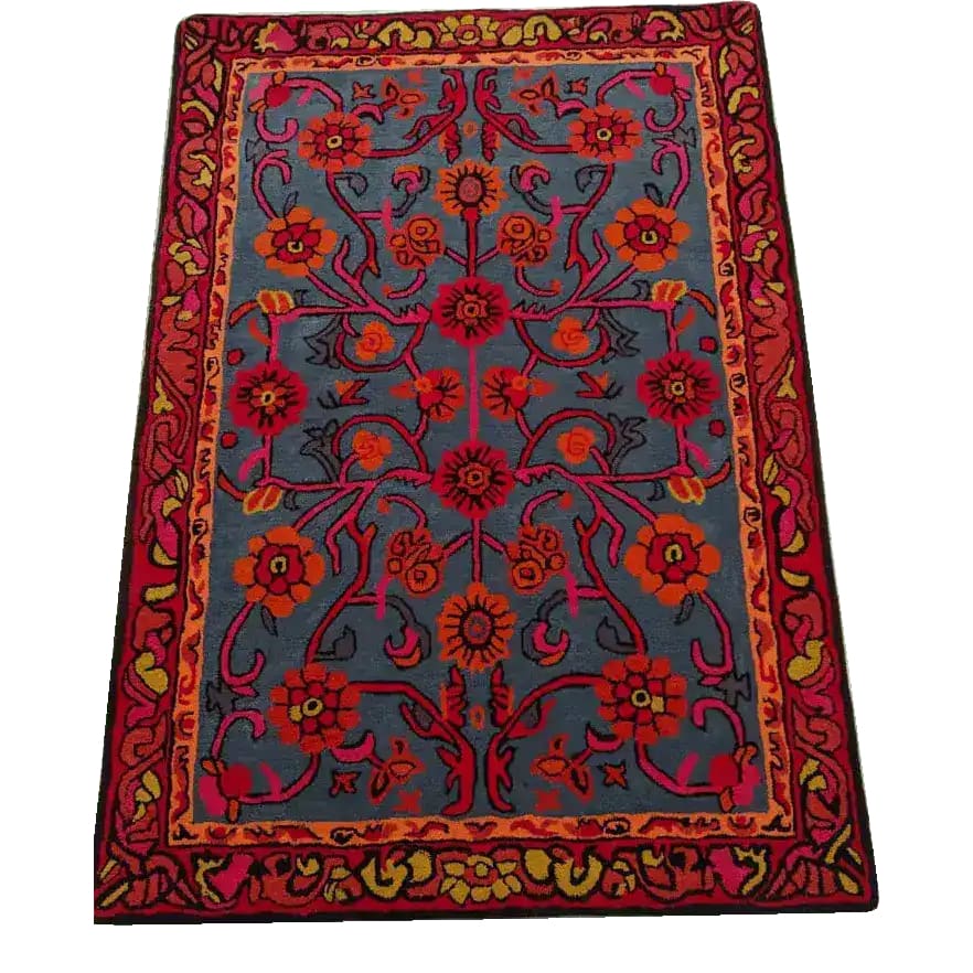 A vibrant Red Bloom Harmony hand-tufted wool area rug featuring an intricate floral pattern. Ideal for adding a vintage touch to dining rooms or as a statement piece in living rooms. This 8x10 rug combines rich reds and oranges with a classic design.