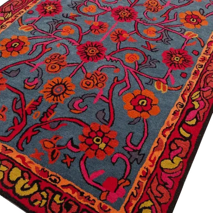 This vibrant hand-tufted area rug features a stunning floral design with red and orange blooms on a rich blue background. Perfect for adding a vintage touch to any dining room or living room setting, this 8x10 wool rug offers both style and comfort.